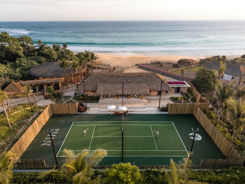 Aerial view of the oceanfront tennis court at NIHI Sumba